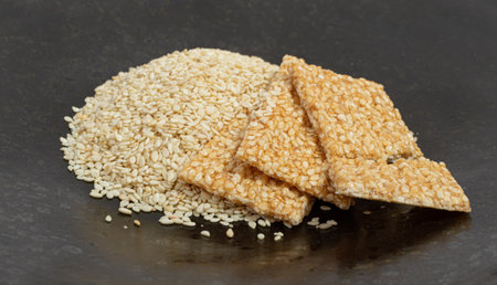 Sesame Snack, Sweet Cereal Breakfast, Honey Seed Cracker, Sesame Candy Bar on Black Backgroundの写真素材