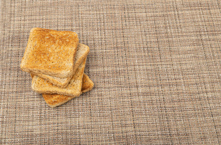 Bread Toasts on Rustic Background, Toasted Sandwich Square Slices, Loaf Pieces for Toast on Brown...