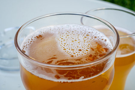 Beer Glass Closeup, Beer Foam Texture Background, Low-Alcohol Drink Froth in Summer Street Bar