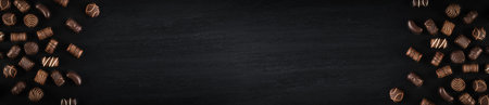 Bonbon Chocolate Pralines Texture Background, Cocoa Candies Banner, Chocolate Pralines on Black with...