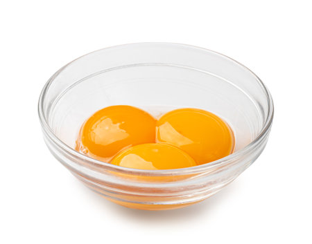 Egg Yolks in Bowl, 3 Fresh Chicken Egg Yolk Separated from Whites for Cooking Recipe, Three Organic Yolks in Glass Bowlの写真素材