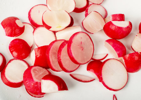 Sliced Radish Roots Isolated, Red Root Round Cuts, Red Radishes Slice Pile, Radis cross sections on White Background Top Viewの写真素材