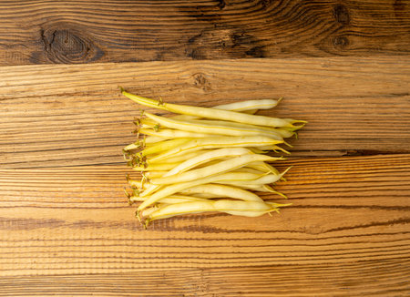 Yellow French Beans on Rustic Wooden Table, Raw String Beans Pile, Fresh Wax Bean Pods on Vintage...