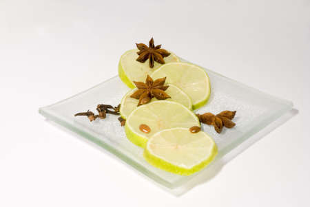 Still-life with lime slices and cinnamon starsの写真素材