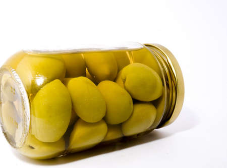 A bottle of green olives, in close-upの写真素材