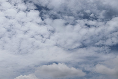 Blue sky and white cloud backgrounds and textures closeup for wallpaper design.