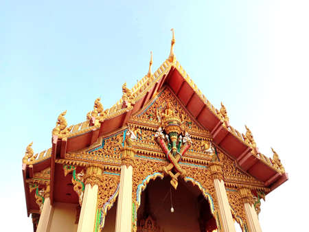 Front, entrance gate and roof of Buddhist temple isolated on white background closeup. Is a place religious ceremonies for Thailand people culture.のeditorial素材