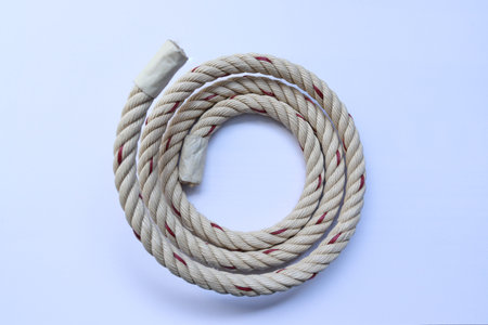 Nylon ship rope rolls in a circle isolated on white background closeup.