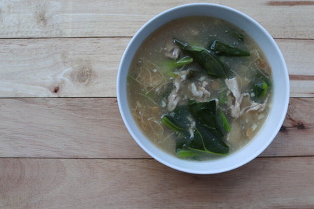 Fried soup noodles, Pork, and Kale with sauce in the bowl, delicious food Thai people called Rad Na...