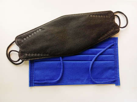 Face masks black, blue wearing to anti, protection virus isolated on white background closeup.の写真素材