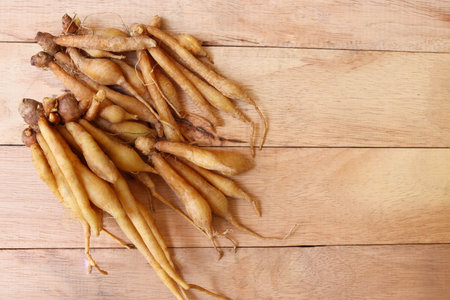 Ginseng root on wooden background. Ginseng root on wooden background.