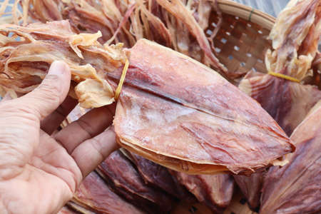 Dried squid at street food in Thailand, dried squid in basketの写真素材
