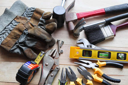 Set of work tools on wooden background. Top view. Copy space.の写真素材