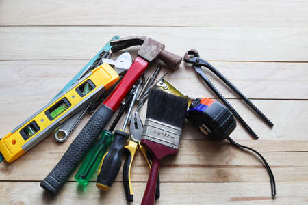 Assorted construction tools on a wooden background. Top view with copy space.の写真素材