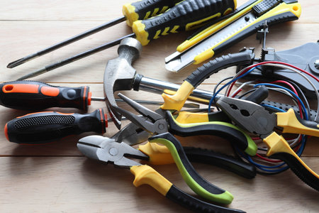Variety of tools on wooden table, closeup. Repair service
