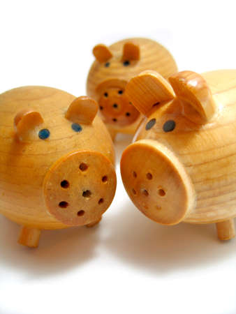 Three wooden pigs salt-cellarの写真素材