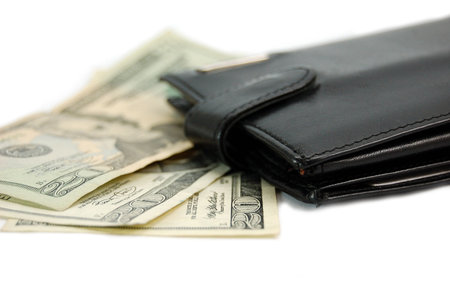 black leather wallet with some twenty's bank notes