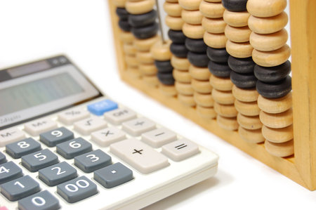 Abacus and calculator isolated on white