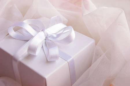 Present white box with silky ribbon in lacesの写真素材