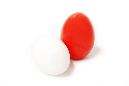 Red and white egg isolated on whiteの写真素材