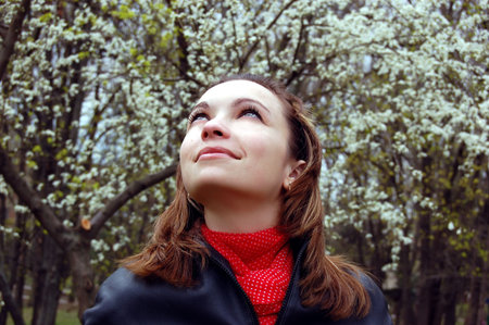 girl admiring blooming garden