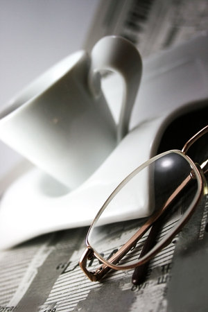 cup of coffee, newspaper and glassesの写真素材