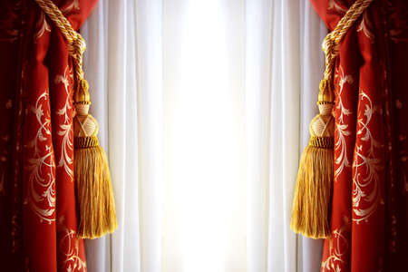 Red luxury curtain with a copy space in the middleの写真素材