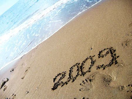 new year 2009 written on the beach sandの写真素材