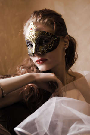 beautiful woman in mask looking mysteriousの写真素材