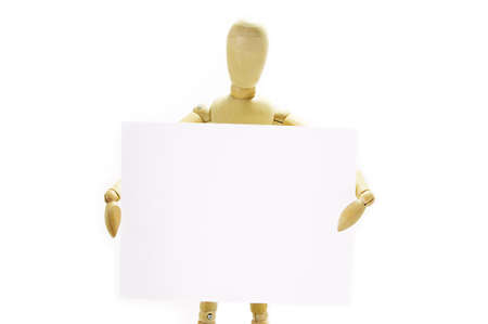 Wooden mannequin holding blank note on white backgroundの写真素材