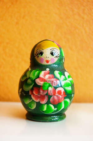 Russian traditional wooden dolls over orange backgroundの写真素材