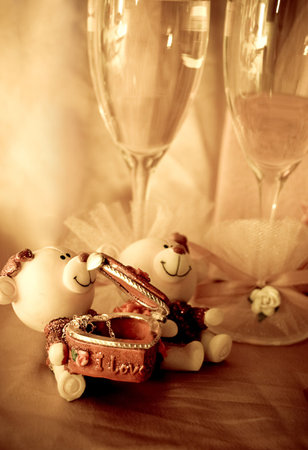 Two glasses of wine and figurine, love conceptの写真素材