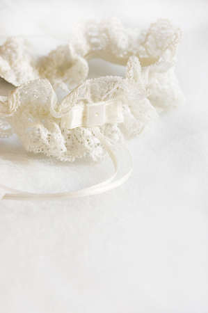 Wedding garter on white satin fabricの写真素材