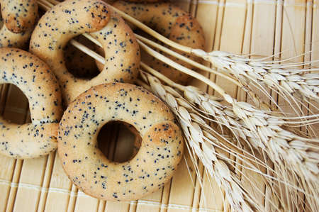 Spikes of wheat and some biscuitsの写真素材