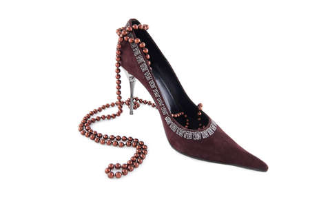 High heel velvet shoe with beads over whiteの写真素材