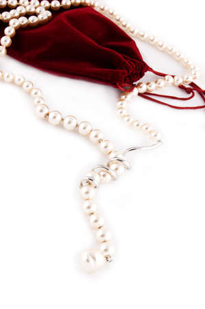 Pearl necklace and velvet bag isolated on whiteの写真素材