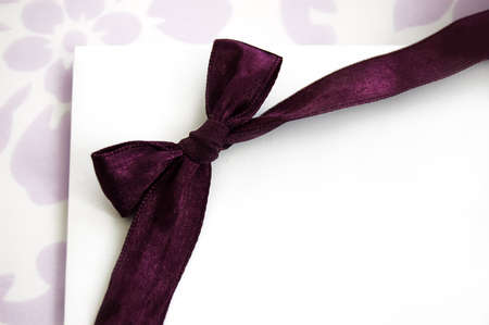 Gift card on holidays with violet bowの写真素材