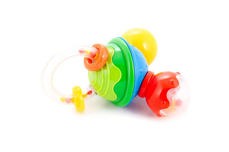 Multicolored baby rattle isolated on white