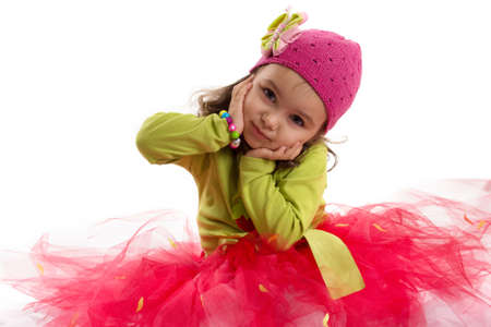 Adorable girl in tutu and hat with butterfly over white backの写真素材