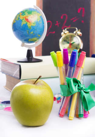 Back to school concept with stationary and apple isolated on whiteの写真素材