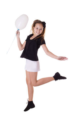 Happy girl jumping with balloon isolated on white, in motionの写真素材