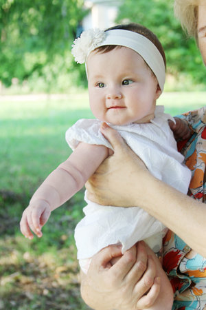 Happy five months baby girl outdoor
