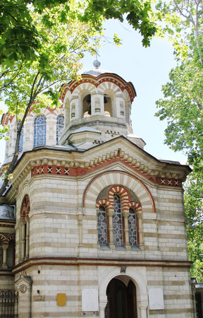 Orthodox christian church among green trees