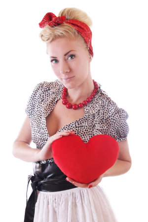 Pinup woman holding plush heart isolatedの写真素材