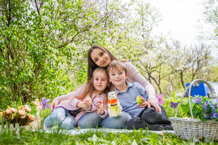 Mother and two children with Easter decorの写真素材