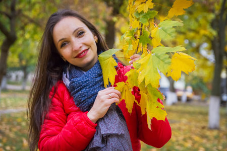 Autumn woman with crown of yellow maple leavesの写真素材