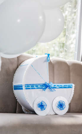 Blue paper carriage decor with balloonsの写真素材