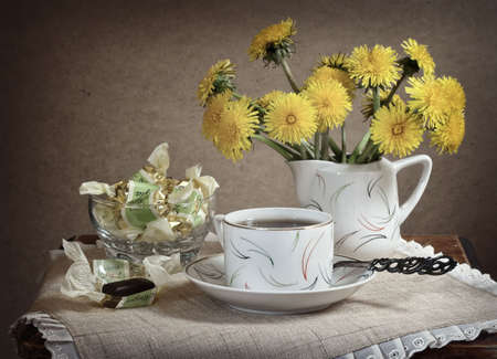 Still life with the tea, the candies and the colors.の写真素材