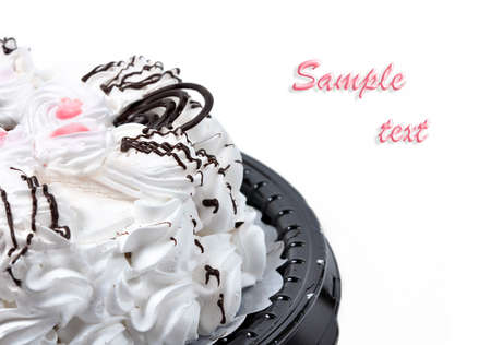 Cream cake against the white background.の写真素材