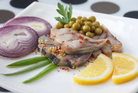 Herring with the green peas and the lemon の写真素材